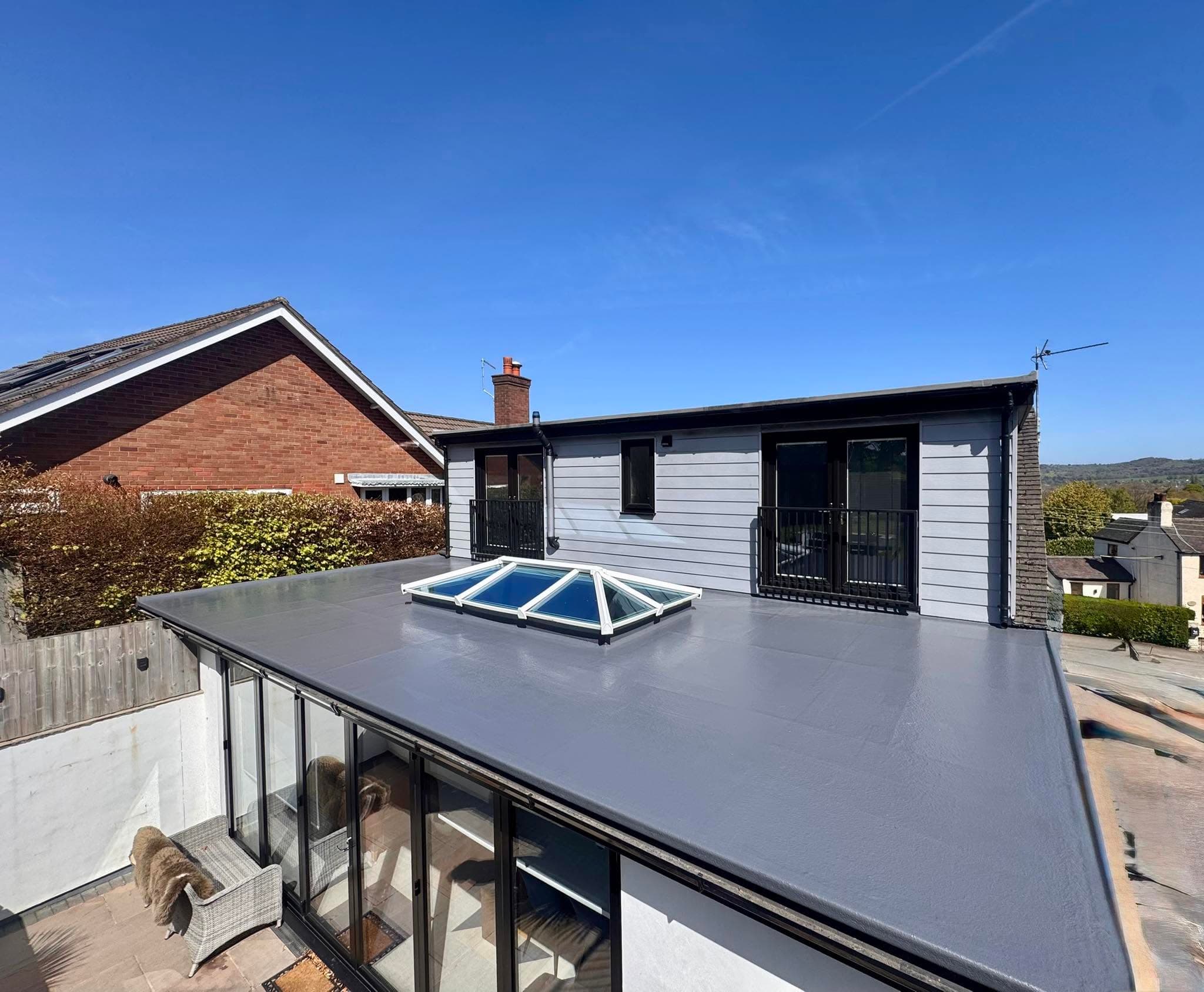 A finished grey GRP fibreglass flat roof with a roof lantern on a home in Staffordshire